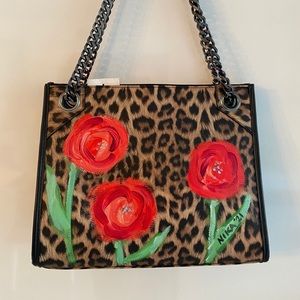 Handprinted by artist over Leopard print bag